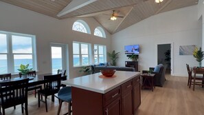 The Great Room features a dining room table that seats 8, cypress T&G ceiling