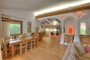 Dining and kitchen with a bar area