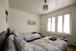 Comfortable Twin bedroom.   bedside light, large clothes drawer, hook & hangers.
