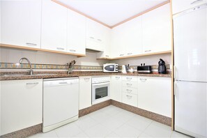 Modern and bright kitchen fully equipped with all the appliances