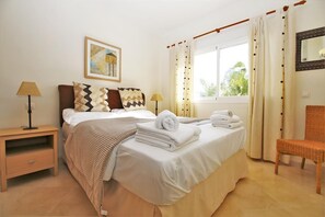 Beautiful master bedroom with king size bed, air conditioning and en-suite bathroom