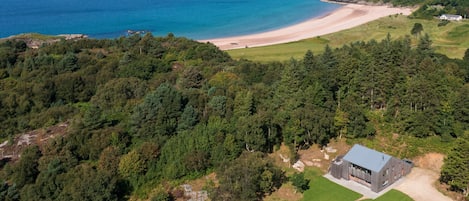 The Lighthouse is on a peninsula between Gairloch Beach and Flowerdale Bay