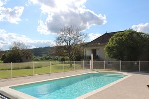 Large swimming pool and hill views