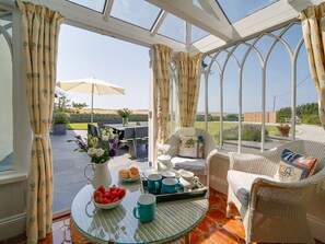 Front terrace with slate table, garden furniture & bbq.  Beach & ocean views.  