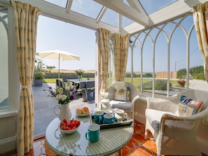 Front terrace with slate table, garden furniture & bbq.  Beach & ocean views.  