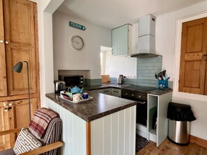 Kitchen area, equipped with fridge-freezer, oven, microwave and kettle.