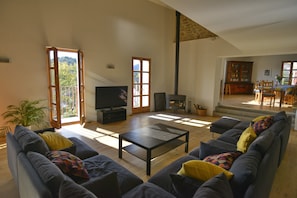 Lounge with small balcony, Tv & wood burner.