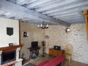 Lounge showing beams and stone walls, TV DVD and Hifi