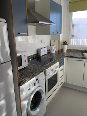 Kitchen complete with washing machine, dishwasher, microwave, fridge freezer