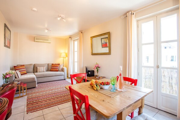 Bright open living area leading onto sunny balcony.