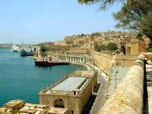 View along St Barbara's Bastion towards apartment and Upper Barraka