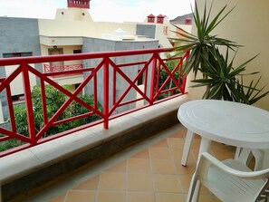 Downstairs is the breakfast balcony,  just off from the living room.