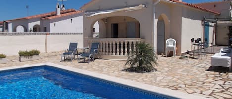 The villa and pool