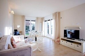 The living room here at "Village Centre, Lake View Pool Apartment."