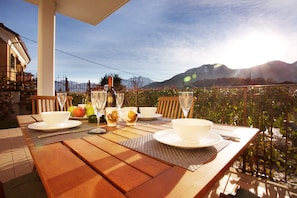 Breakfast on the terrace "Village Centre, Lake View Pool Apartment."