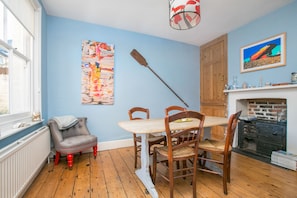 Lovely light dining room with vintage french chairs and table