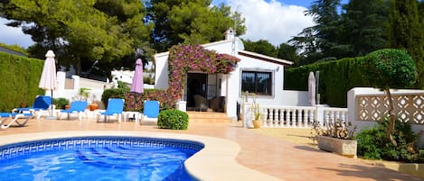 Pool with villa in the background. 