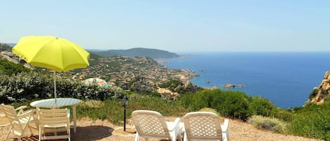 Sun loungers and sea and village view