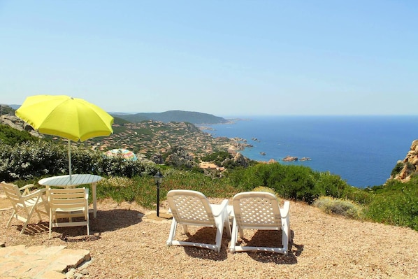 Sun loungers and sea and village view