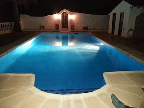 Pool illuminated in the evening