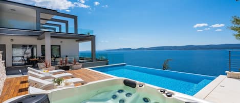 VILLA HRID with infinity heated pool with massage and private beach