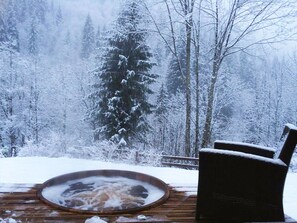 Scandanavian hot tub, sunk into the deck with views of the Nyon mountainside