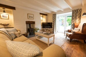Light airy but cosy lounge with french doors opening into the garden. 