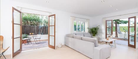 Apartment Can Tony for 6 persons, central location on the beach and sea of Alcudia white sandy beach: Spacious and bright living room with internet TV - perfect to chill and relax