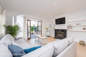 Apartment Can Tony for 6 persons, central location on the beach and sea of Alcudia white sandy beach: Spacious and bright living room with internet TV - perfect to chill and relax 
