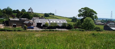 Lower Curscombe Barn, a beautiful conversion of a 400-year-old threshing barn, comprises two adjacent properties together sleeping 12