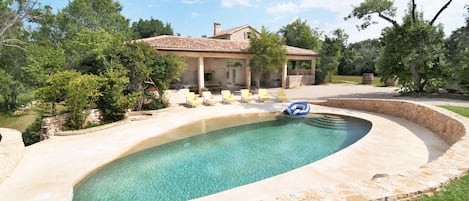 Refreshing pool surrounded by lush greenery