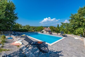 Large and private pool with plenty of sunbeds