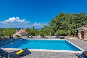 Large and private pool with plenty of sunbeds
