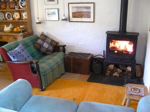 Living area  with log burner.