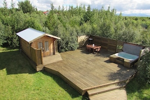 Bath house, outdoor dining area and hot tub