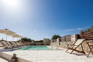 Sun beds, umbrellas and an outdoor shower are available at the pool terrace.