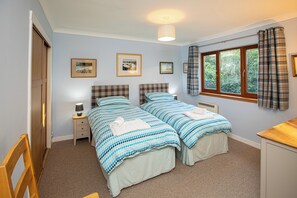 Bedroom 2 with twin beds facing the garden