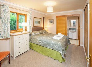 Bedroom 3 and en suite shower room facing the garden