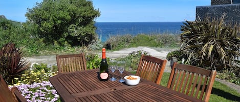 Morning Cottage patio and garden overlooking the sea