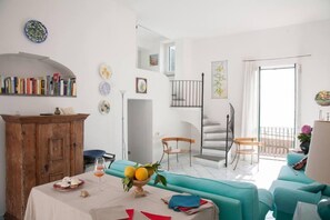 Living room with balcony overlooking the sea