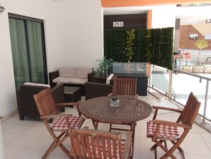 Front terrace with dining area and sofa group