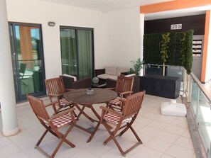 Front terrace with dining area and sofa group