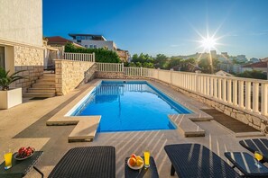 Private pool area with sun loungers