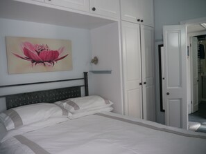 Double bedroom. Beach chairs in cupboard for beach trips.