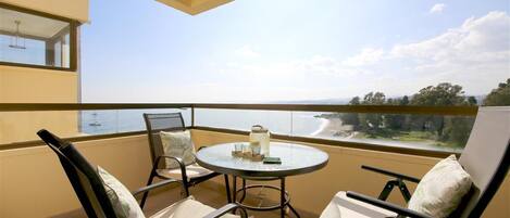 South-west facing balcony with outdoor dining area and stunning sea views