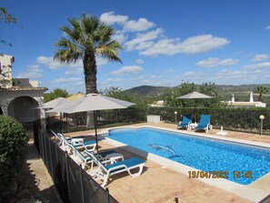 There are mountain and countryside views from the poolside.