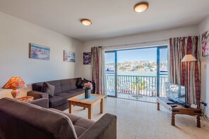 Living Area Leading To Balcony With Sea Views.