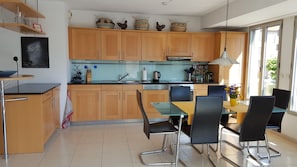 Sunny, well-equipped kitchen and dining area