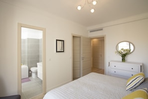 The master bedroom has an en-suite and walk-in wardrobe