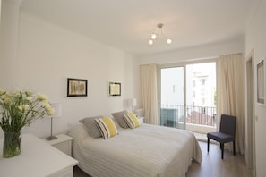 The master bedroom has a king-size bed, en-suite bathroom and balcony